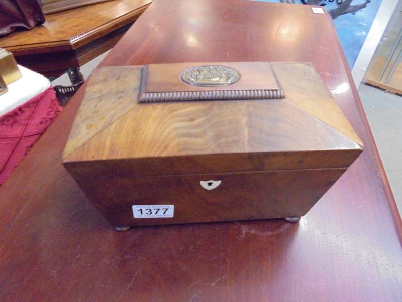 A Victorian mahogany tea caddy.