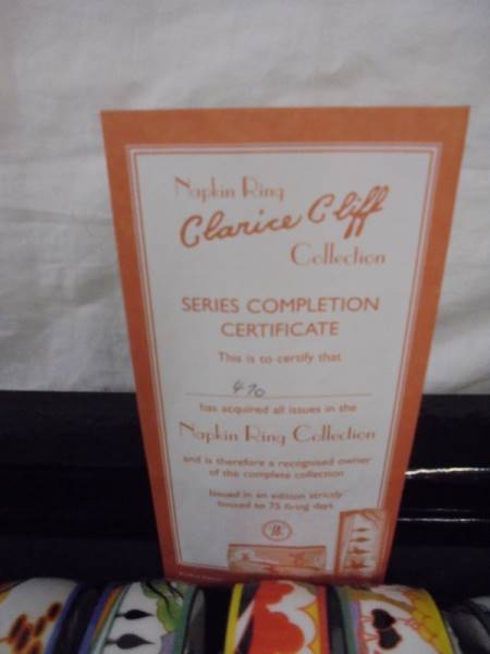 A boxed set of six Clarice Cliff napkin rings. - Image 3 of 3