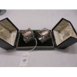 A cased pair of silver napkin rings, Birmingham 1914. 1 A/F