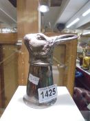 A silver plate stirrup cup featuring a hare head.