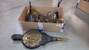 A box of brass and copper including funnels, chestnut roaster, bellows etc