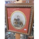 A framed and glazed print of a small boy on a rocking horse, COLLECT ONLY.