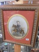 A framed and glazed print of a small boy on a rocking horse, COLLECT ONLY.