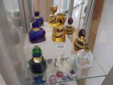 Four coloured glass scent bottles and two clear glass examples.