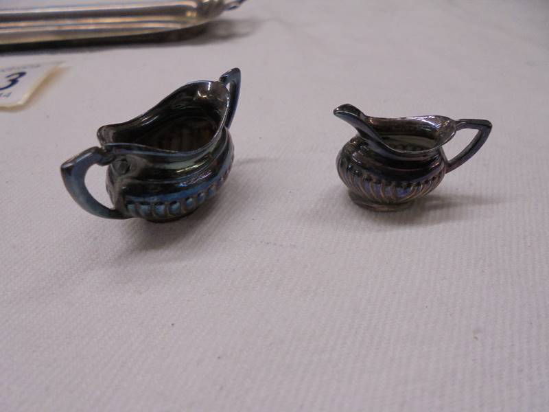 A miniature four piece tea set on a silver tray, D H & S, Birmingham 1973, 65 grams. - Image 4 of 6