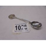 A hall marked silver golfing spoon.