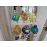 Six assorted studio glass bud vases.