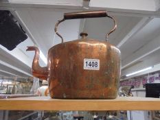 A large oval copper kettle.