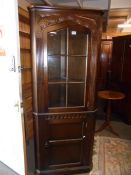 An corner cabinet with glazed top in oak, COLLECT ONLY.