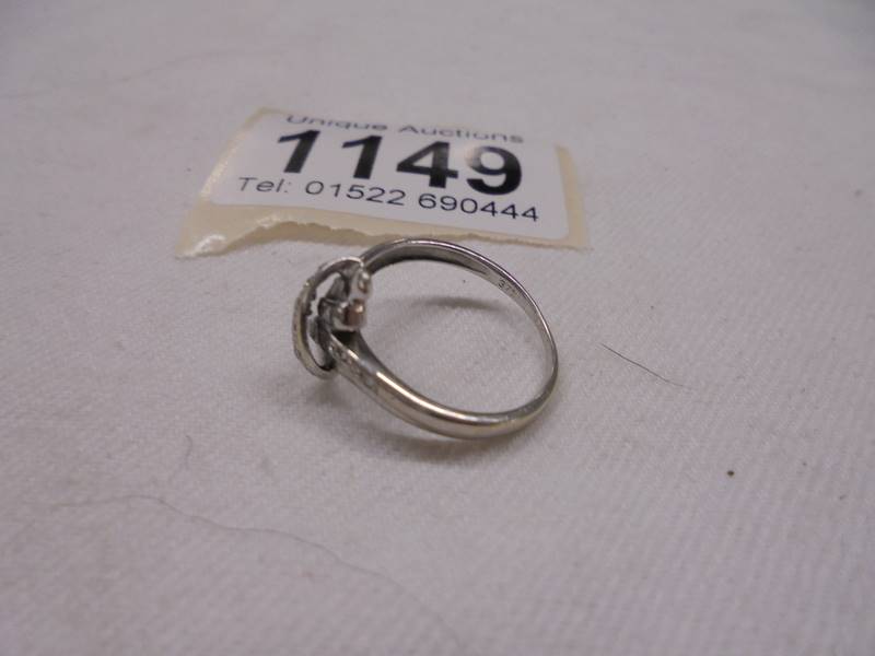 A diamond ring fashioned as a crossover in 9ct white gold, size K half, 2.2 grams. - Image 2 of 2