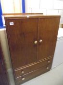A Stag style mahogany effect tallboy. COLLECT ONLY.