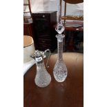 A tall cut glass decanter height 50.5cm and cut glass jug