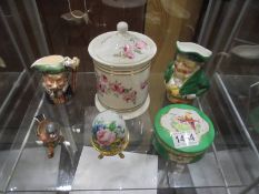 A mixed lot of ceramics including lidded jar, Toby jugs etc.,