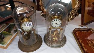 A pair of 1912 German national silver co anniversary clocks for spare or repair