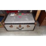 A well travelled large vintage aluminium travel trunk with world location stickers 50cm x 77cm x