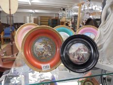 Four Pratt ware plates and a pot lid.
