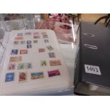 Two albums of world stamps.