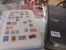 Two albums of world stamps.