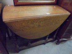 An oak barley twist gate leg table, COLLECT ONLY.