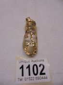 A 9ct gold pendant, 5 grams.