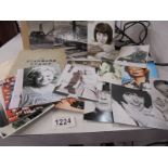 A selection of reprint photographs of Carry on stars, an album of stamps and two large press photo's