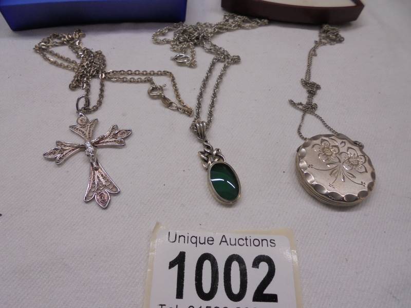 Three silver pendants, a silver locket and a silver (800) crucifix. - Image 4 of 4