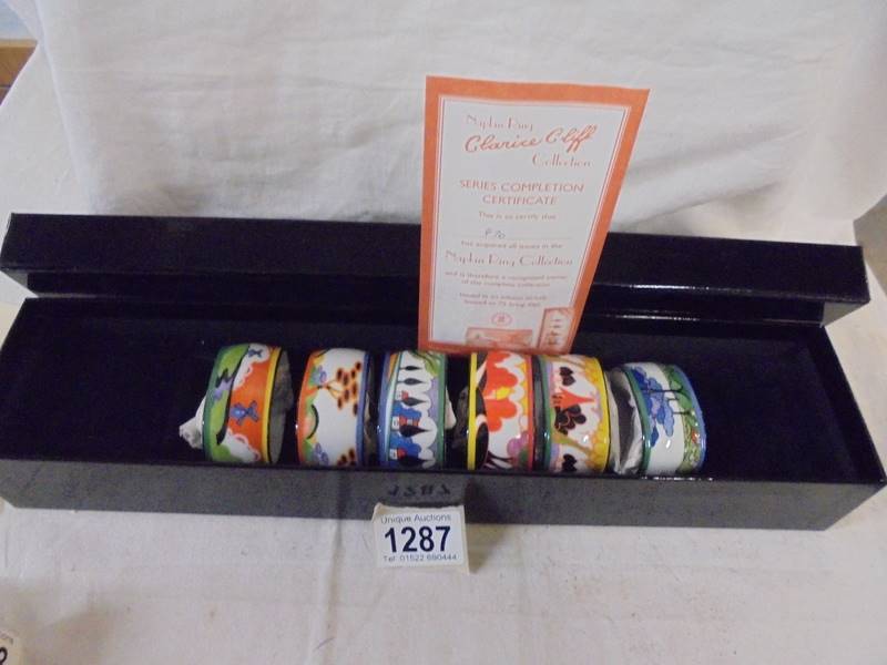 A boxed set of six Clarice Cliff napkin rings.