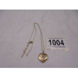 A 9ct gold heart locket on chain,