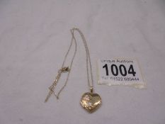 A 9ct gold heart locket on chain,