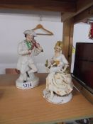 Two continental porcelain figurines.