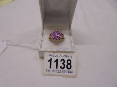 A 9ct gold ring set pink stone cluster, size R, 5.3 grams.