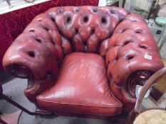 A deep buttoned red leather arm chair, COLLECT ONLY.