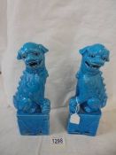 A pair of blue ceramic Chinese Dogs of Fo.