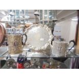 An ornate silver plate tray, teapot and hot water jug.