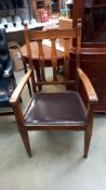 An arts and crafts oak carver chair with tulip cut out back slats, COLLECT ONLY