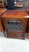 A dark oak display cabinet with leaded glass door, COLLECT ONLY