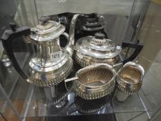 A four piece silver plate tea set.