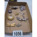 A mixed lot of brooches including micro mosaic, animal related etc.,