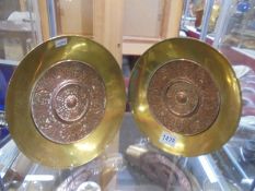 A pair of brass and copper plaques. Dated 1881.