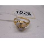 An opal and diamond set ring, tests as 18ct gold, size Q, 3.9 grams.