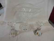 A cut glass vase and a pair of glass candlesticks.