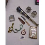 A mixed lot including small hunting horn, mother of pearl compact, racing badges etc.,