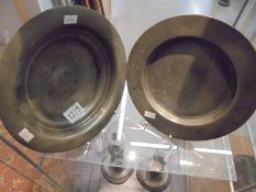 An antique pewter plate stamped 'London' and an antique pewter dish.