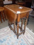 A small oak barley twist gate leg table. COLLECT ONLY.