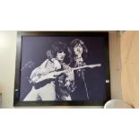 A large framed print of Mick Jagger and Bill Wyman 110cm x 87cm COLLECT ONLY