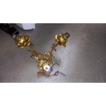 A gilded two lamp wall light