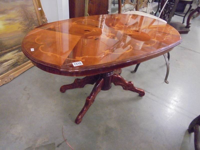 An oval inlaid coffee table, COLLECT ONLY.