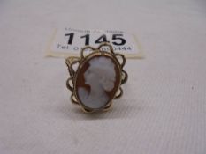 A cameo ring of a female profile dated 1973, hallmarked 9ct gold, size O, 2.6 grams.