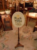 A small pole screen with family crest COLLECT ONLY.