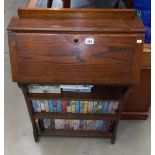 A 1930/50's oak bureau bookcase, including books 66cm x 23cm x height 97cm COLLECT ONLY